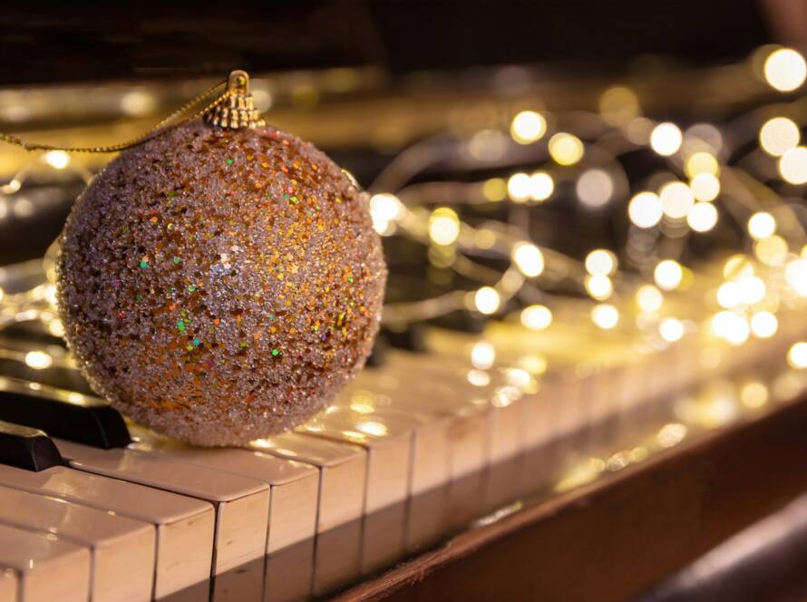 Christmas Piano music and Xmas lights bokeh background.